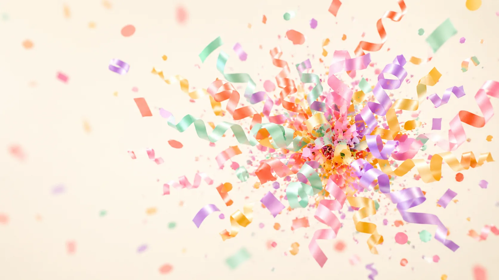 Estallido congelado de confeti y serpentinas de colores en el aire