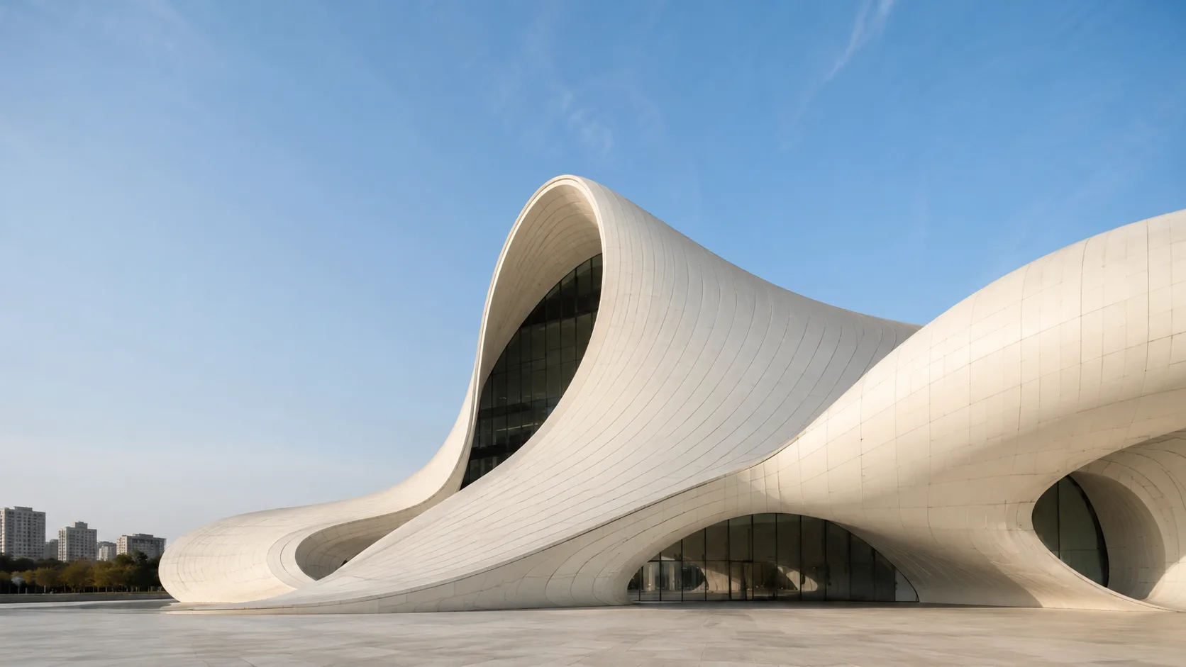 Editorial architecture photograph of a curved contemporary museum with a sculptural facade
