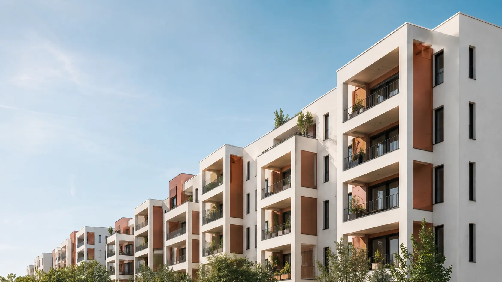 Editorial architecture photograph of a contemporary apartment block with a rhythmic balcony facade