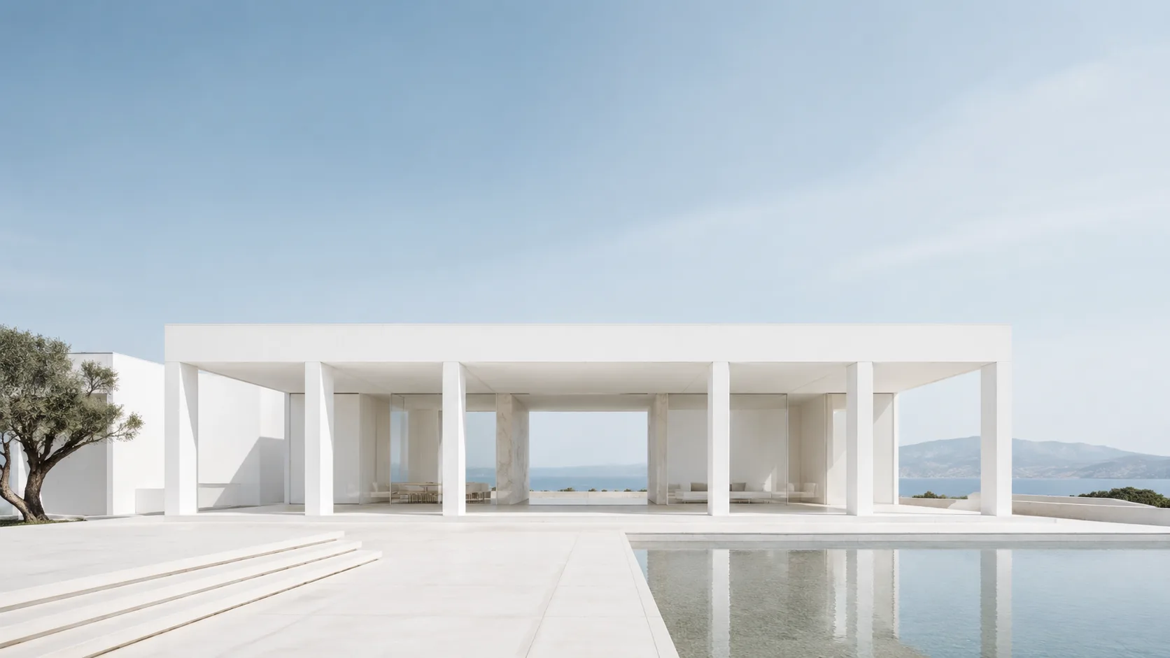 Editorial architecture photograph of a minimalist white pavilion with slender columns
