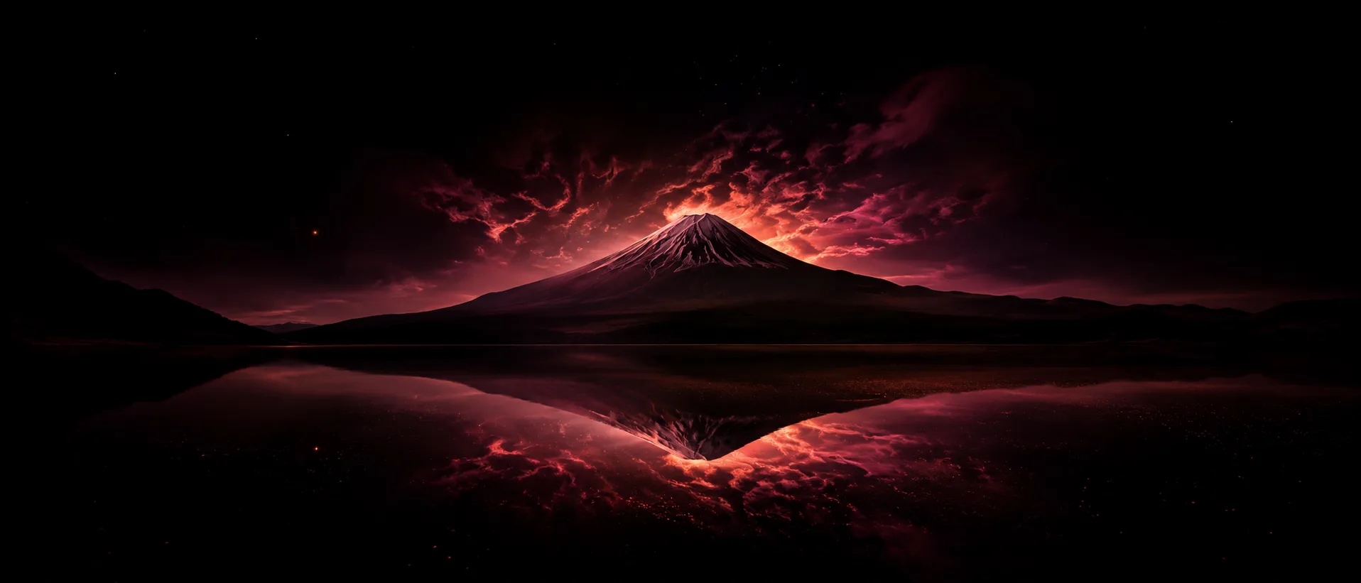 Editorial nighttime photograph of Mt Fuji silhouette mirrored in a dark lake with neon-pink twilight clouds